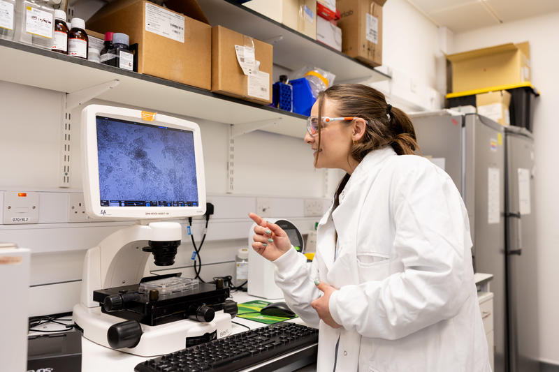 Alex Bailess visiting CureHeart lab