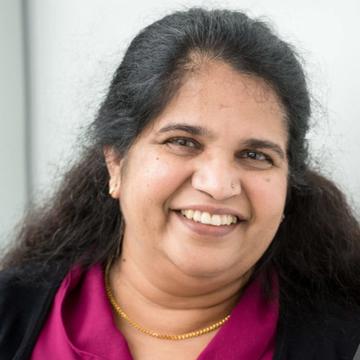 Smiling woman in purple top