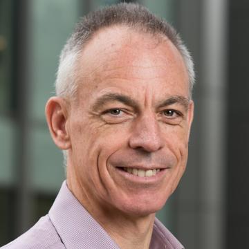 Smiling man in mauve shirt